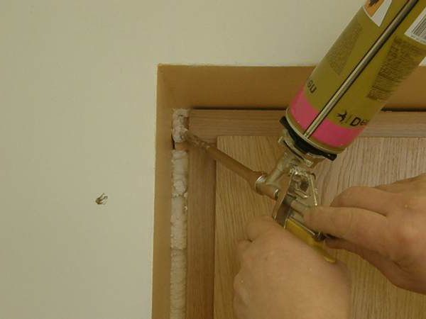 Polyurethane foam for installation of the door frame.