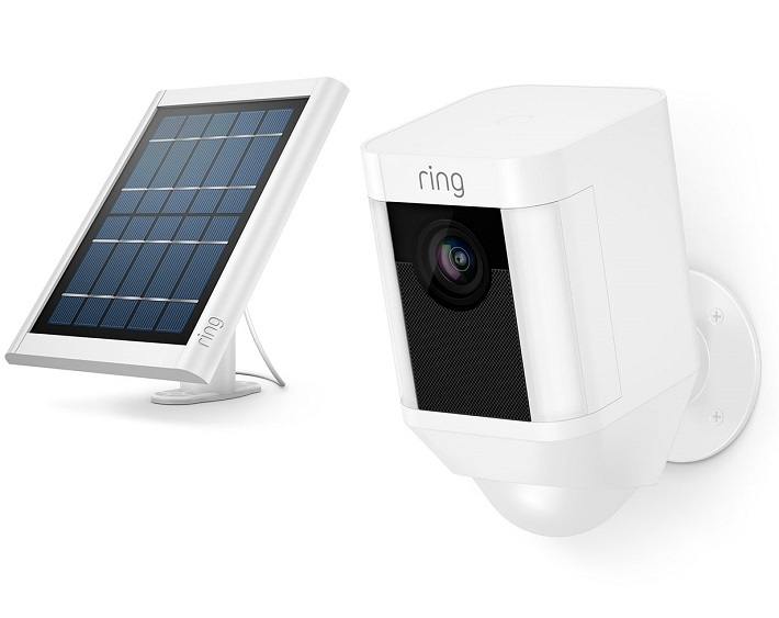 Ring spotlight camera next to its optional solar panel.