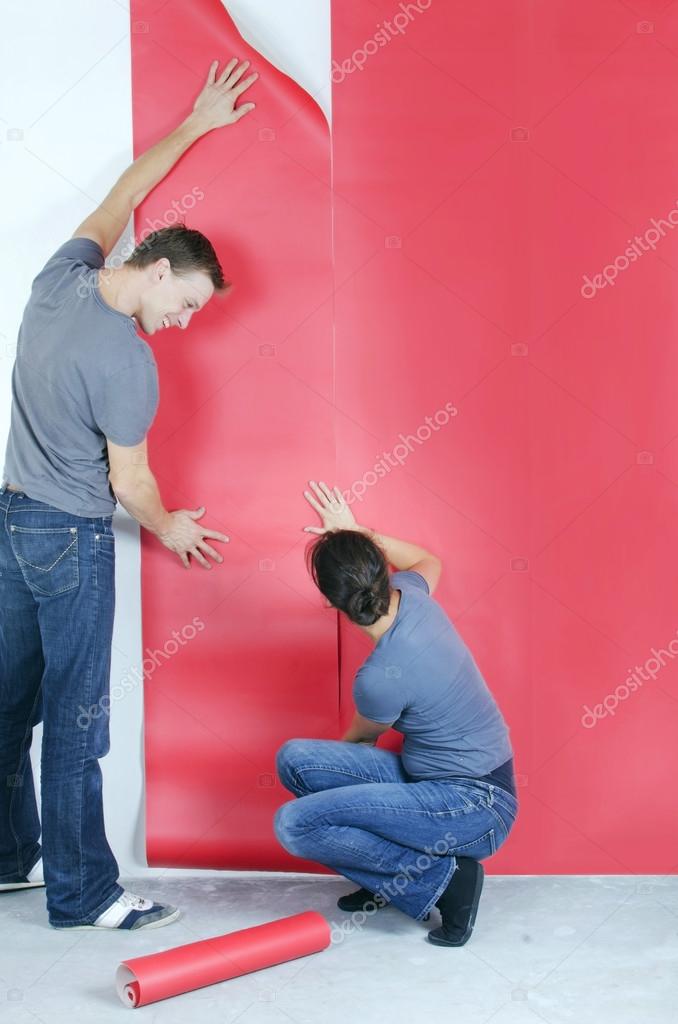 depositphotos 34950865 stock photo man and wife wallpapering